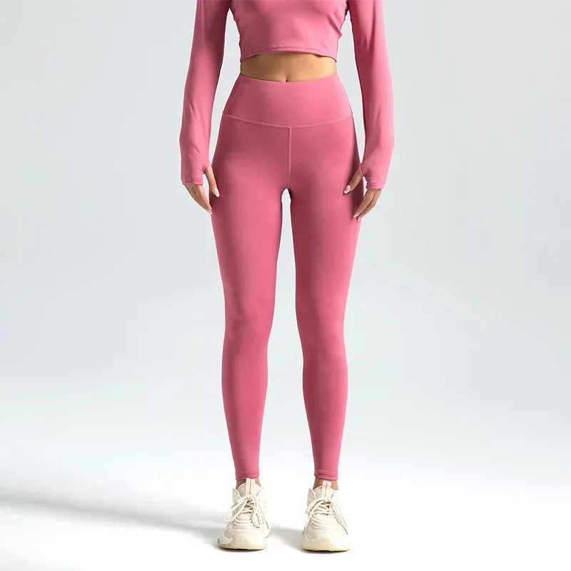 Person wearing pink athletic outfit on a white background