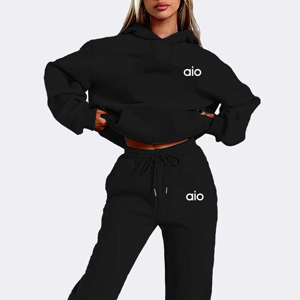 Black hoodie and pants set with 'aio' logo on a plain background