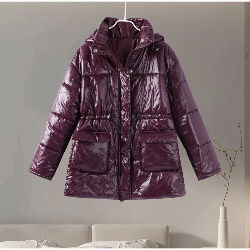 Purple puffer jacket hanging on a white hanger against a neutral background