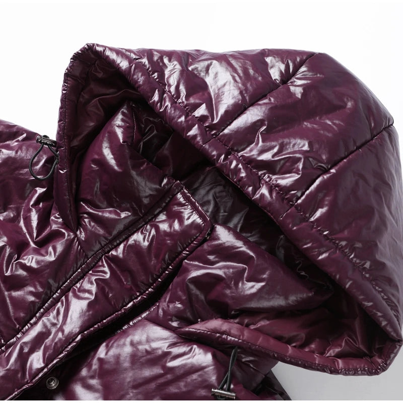 Close-up of a shiny purple puffer jacket with a hood.