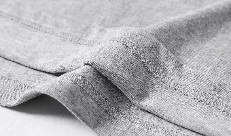 Close-up of gray fabric with visible texture on a white background