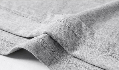 Close-up of gray fabric with visible texture on a white background