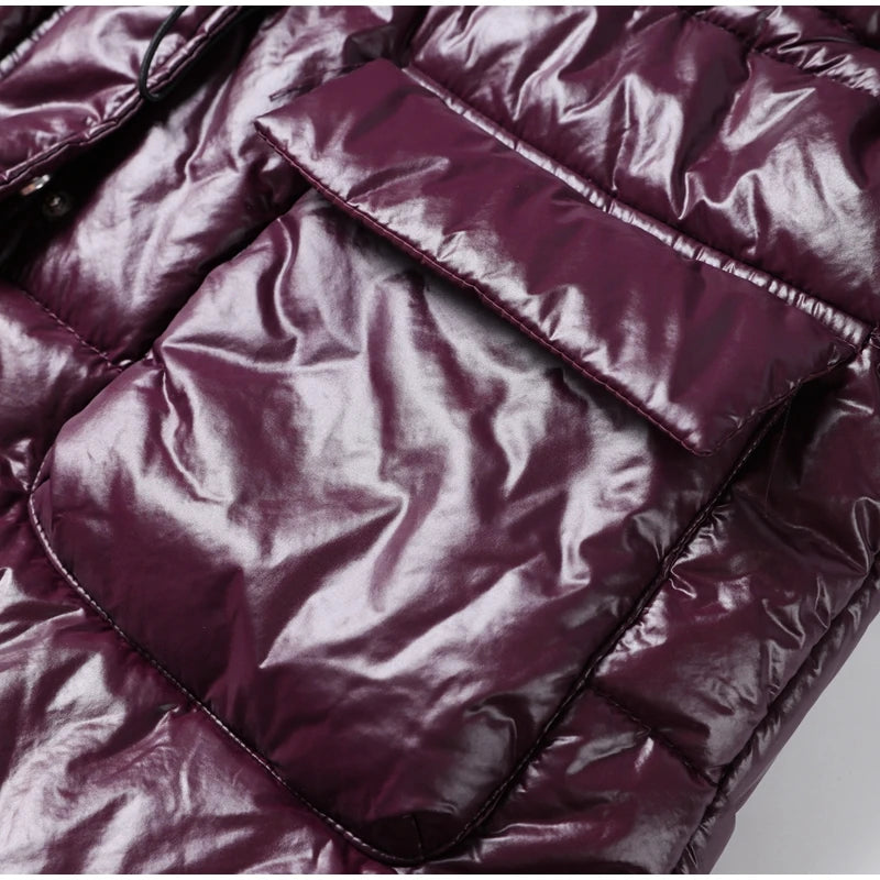 Close-up of a purple quilted jacket with a plain background