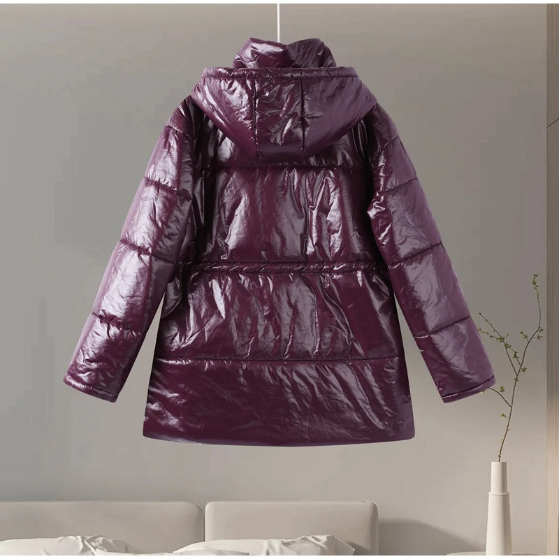 Purple puffer jacket hanging against a neutral wall.