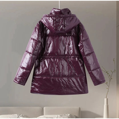 Purple puffer jacket hanging against a neutral wall.