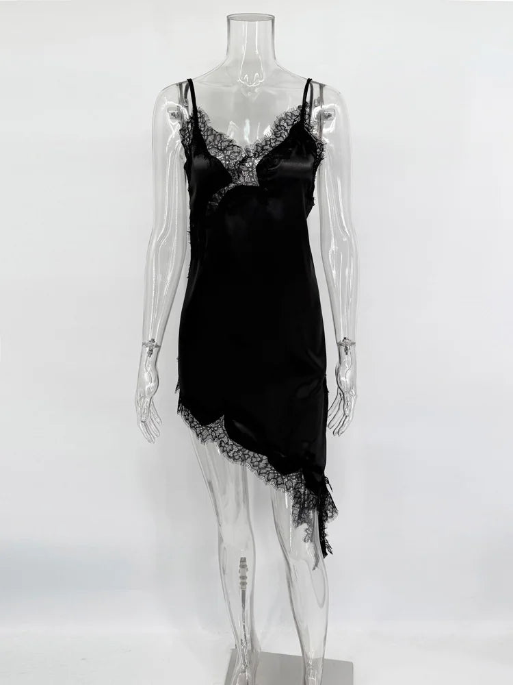 Black satin slip dress with lace trim on a mannequin against a white background