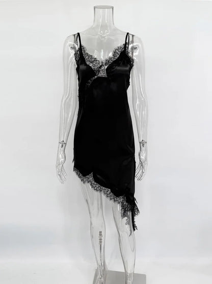 Black satin slip dress with lace trim on a mannequin against a white background