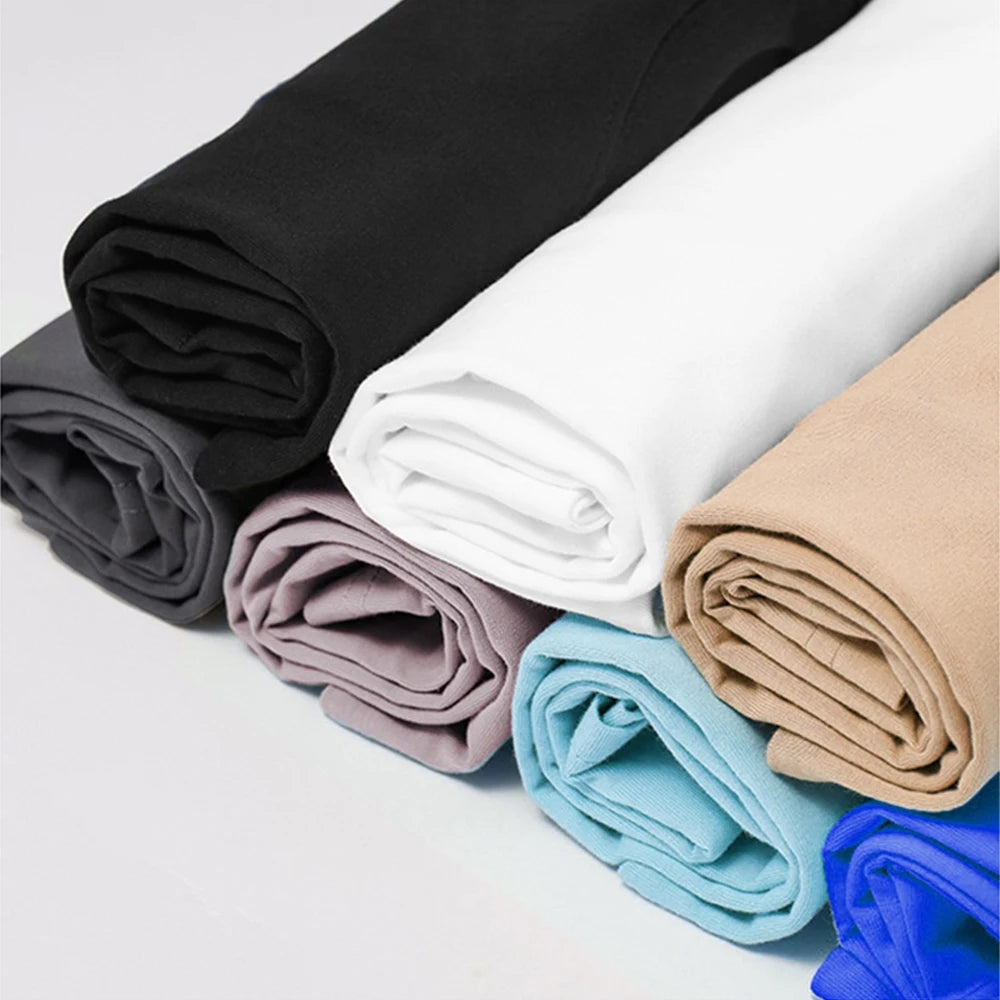 Shirts of fabric in various colors on a light gray background