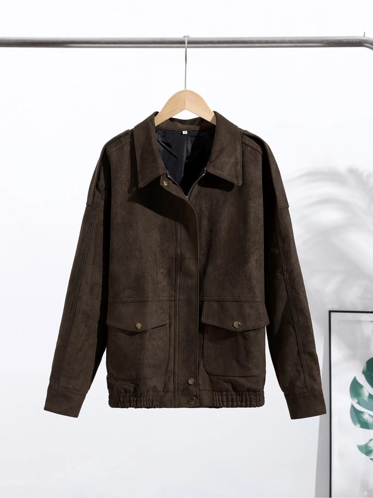 Brown jacket on a hanger against a white background