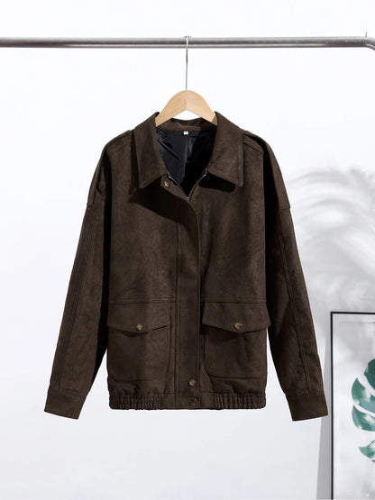 Brown jacket on a hanger against a white background