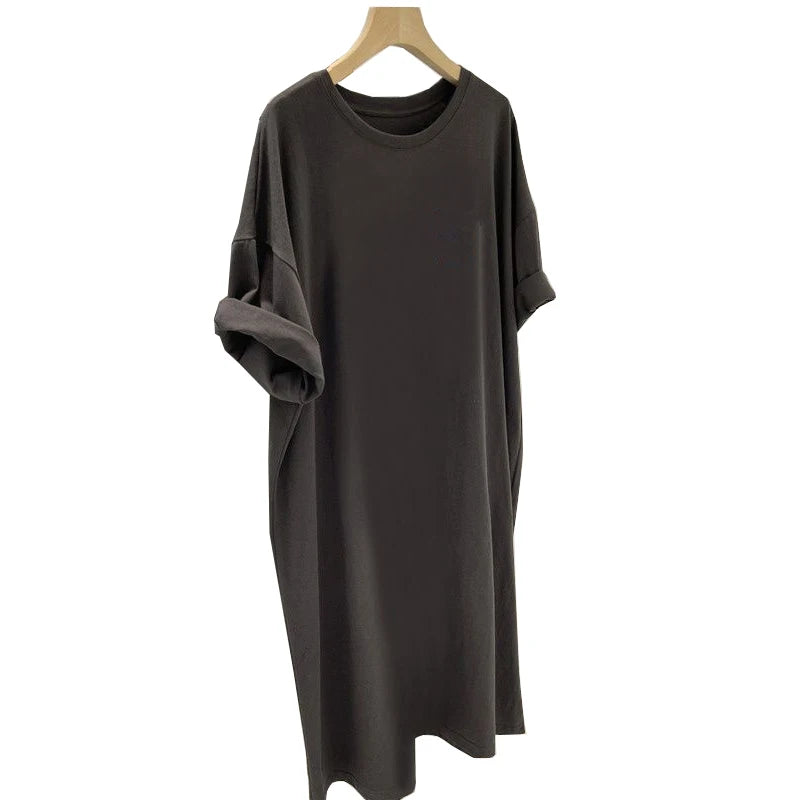 Dark gray dress on a wooden hanger against a white background