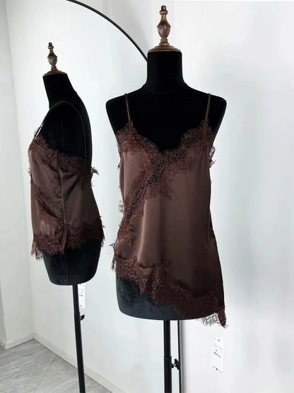 Brown lace-trimmed tank tops on black mannequins against a white background