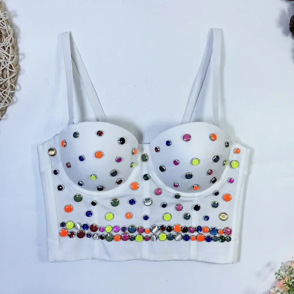 White bra with colorful rhinestone embellishments on a white background