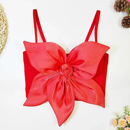 Red floral top on a white background