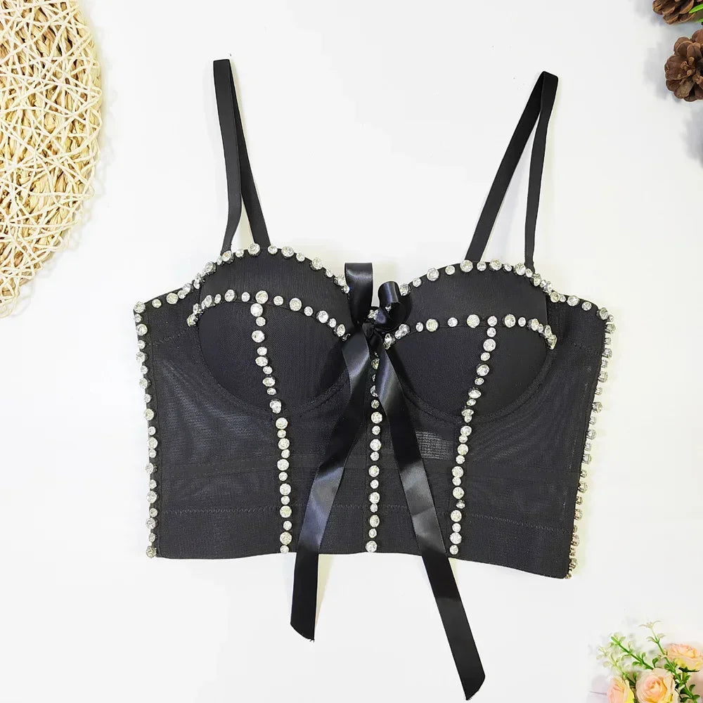 Black bra with pearl embellishments on a white background