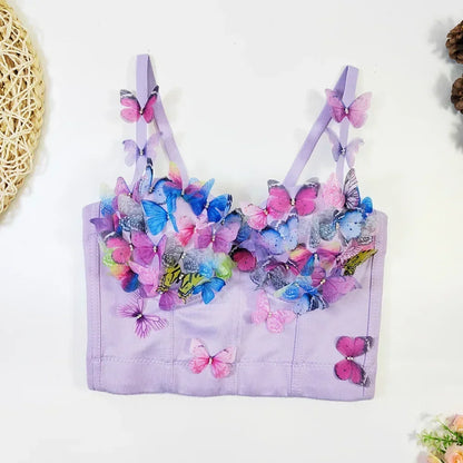 Lavender children's top with colorful butterfly decorations on a white background