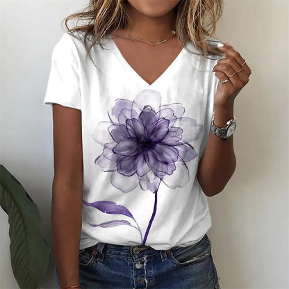 Person wearing a white t-shirt with a purple flower design.
