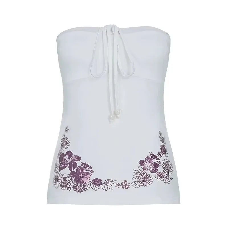 White strapless top with floral embroidery on a white background