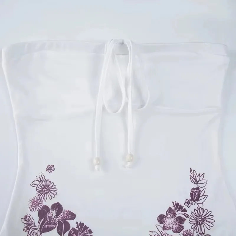 White hoodie with purple floral patterns on a white background