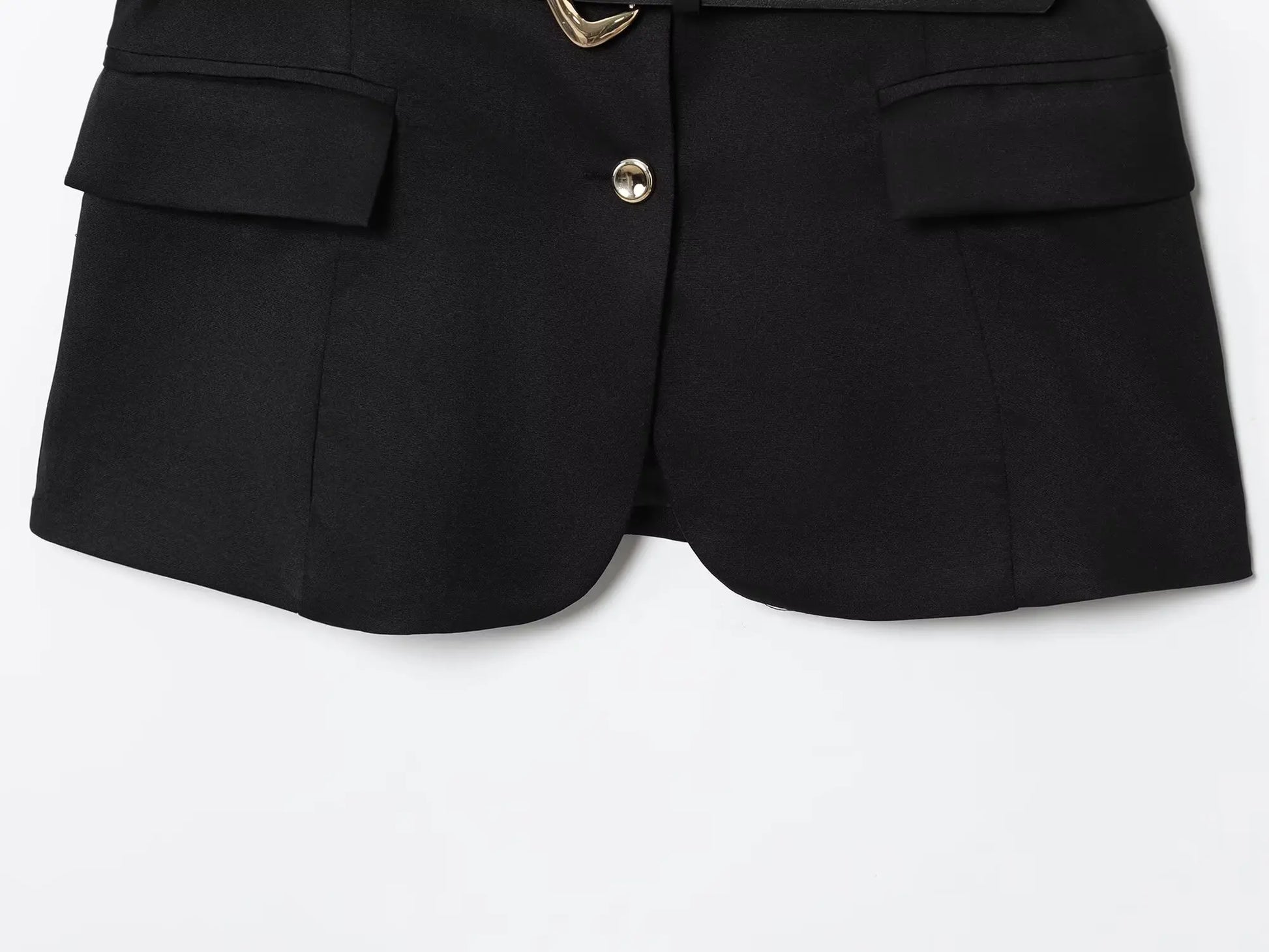 Black shorts with gold buttons on a white background