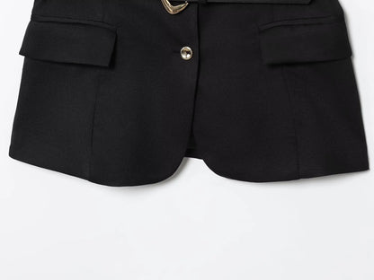 Black shorts with gold buttons on a white background