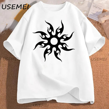 White t-shirt with black tribal sun design on a textured surface, featuring the brand 'USEMEI'.