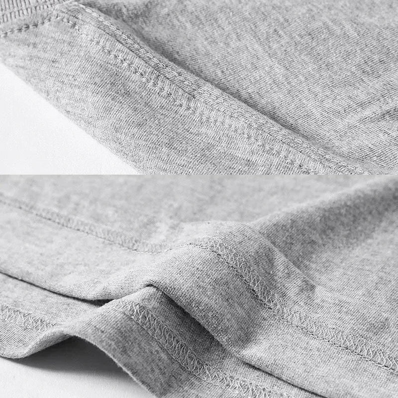 Close-up of gray fabric with a brand label on a white background