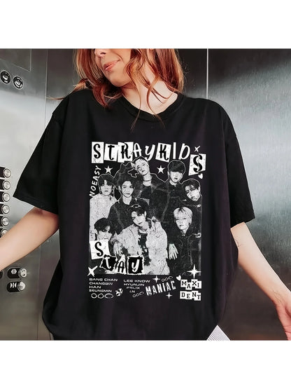 Person wearing a black t-shirt with a graphic design of a group of people and text.