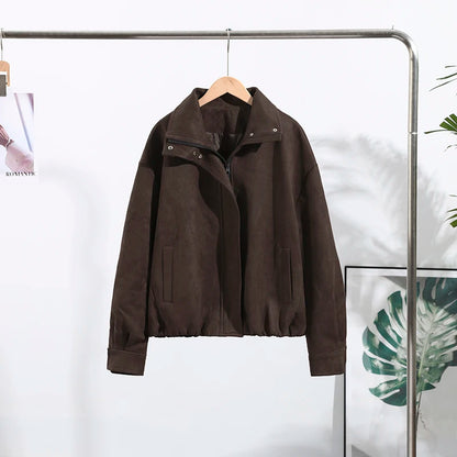 Brown jacket hanging on a rack against a white background