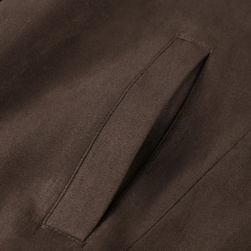 Close-up of a brown fabric with a pocket detail