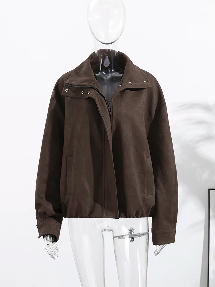 Brown jacket on a mannequin against a white background