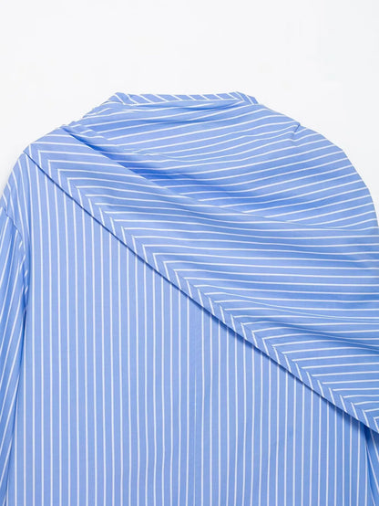 Blue and white striped fabric with a geometric pattern on a white background