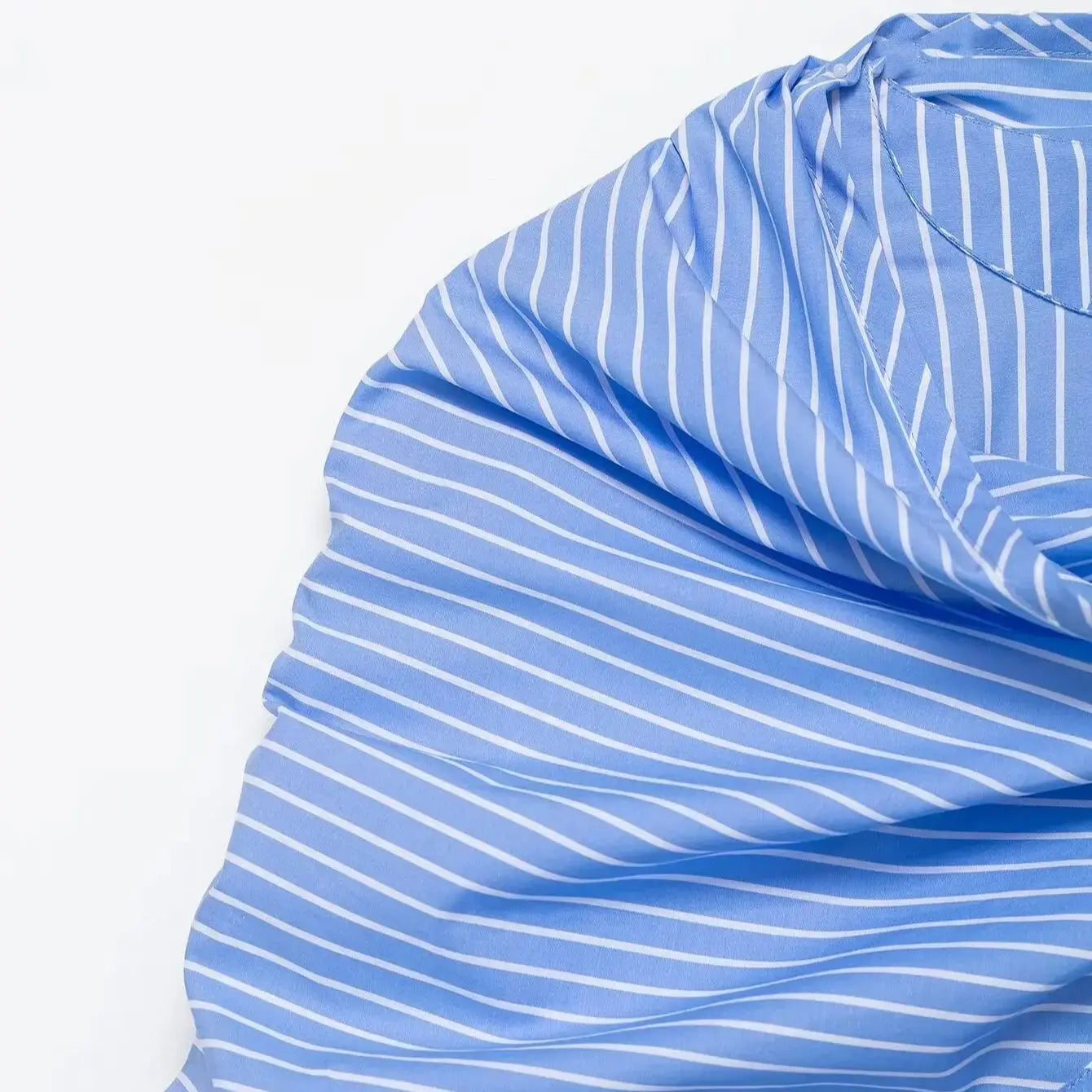 Close-up of blue and white striped fabric on a white background