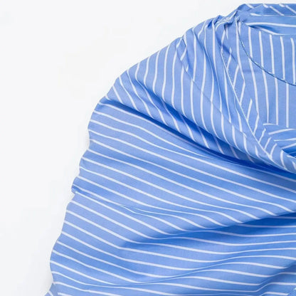 Close-up of blue and white striped fabric on a white background