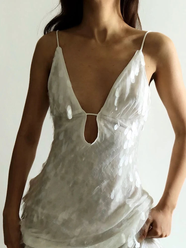 White lace nightgown worn by a person against a neutral background