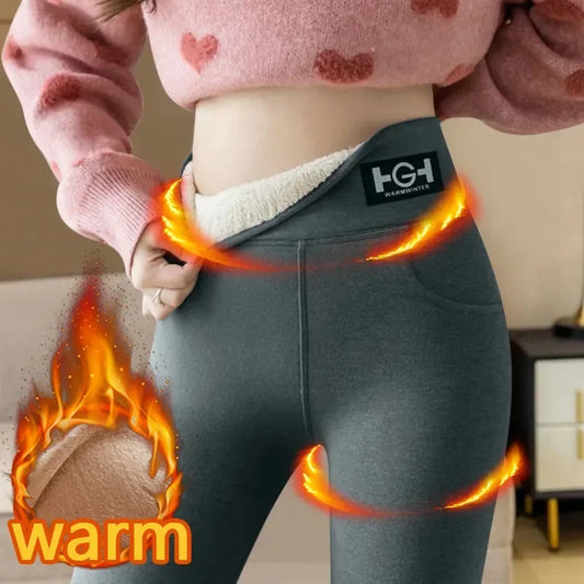 Person wearing gray pants with a 'warm' label and fire effects, brand logo visible.
