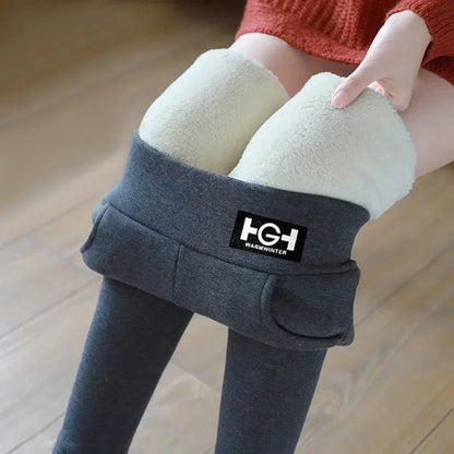 Person wearing gray leggings with white knee pads on a wooden floor, featuring the brand 'H&H'.