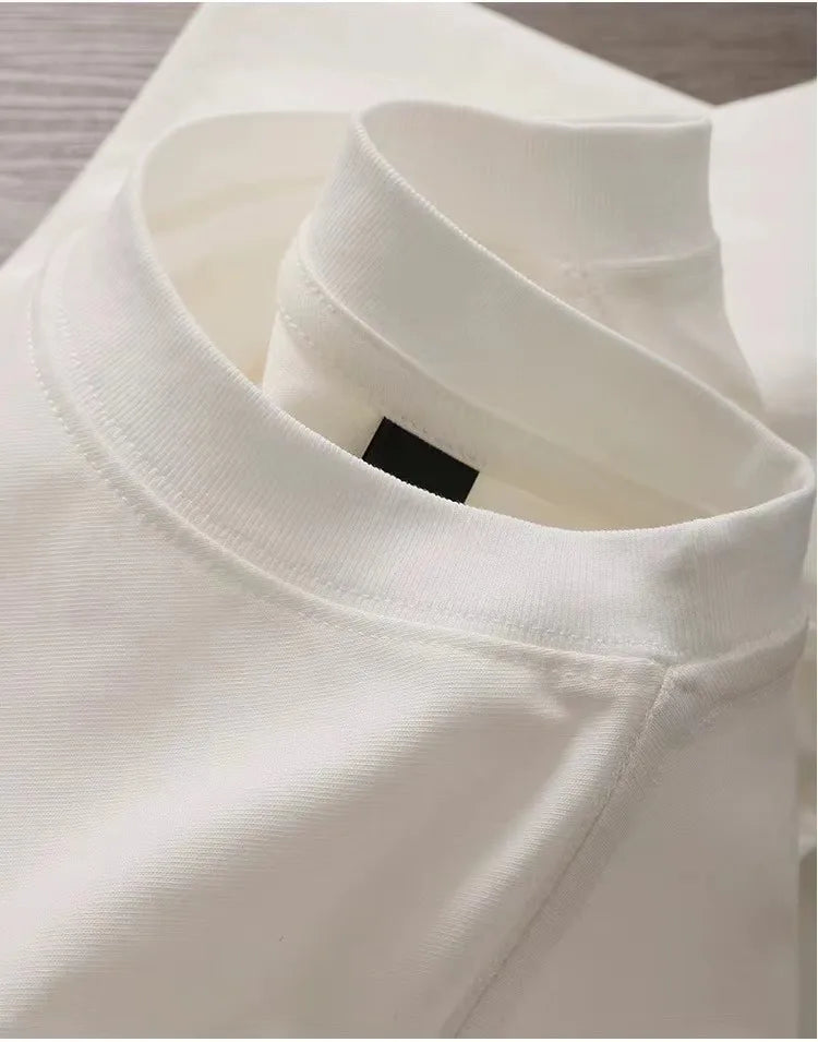 Close-up of a white shirt collar with a brand label.