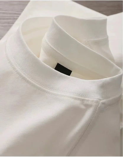 Close-up of a white shirt collar with a brand label.