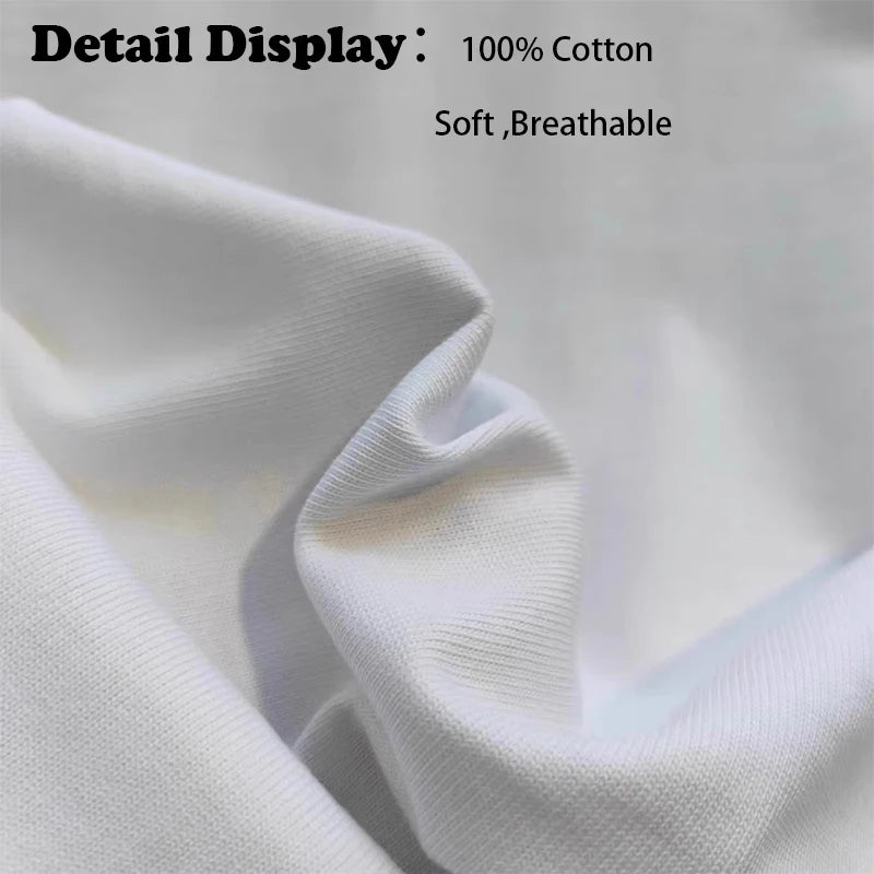 Close-up of white fabric with text indicating 100% cotton, softness, and breathability.