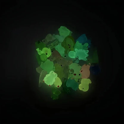 Evlira Luminous Frog Figurines - glowing green animal toys in dark demonstrating glow in the dark effect