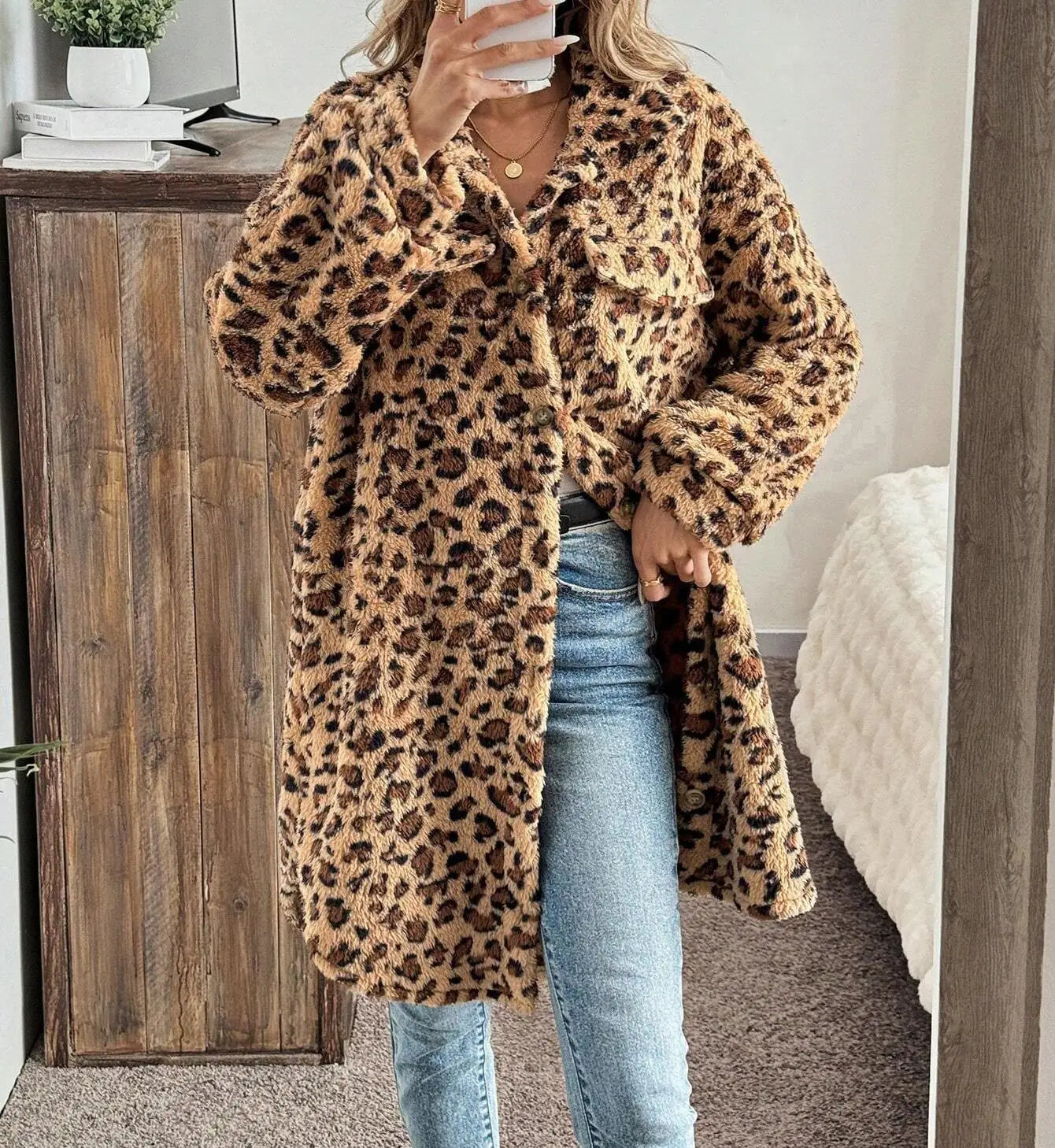Evlira Leopard Print Plush Coat in bedroom setting - cozy winter wear for comfortable home lounging