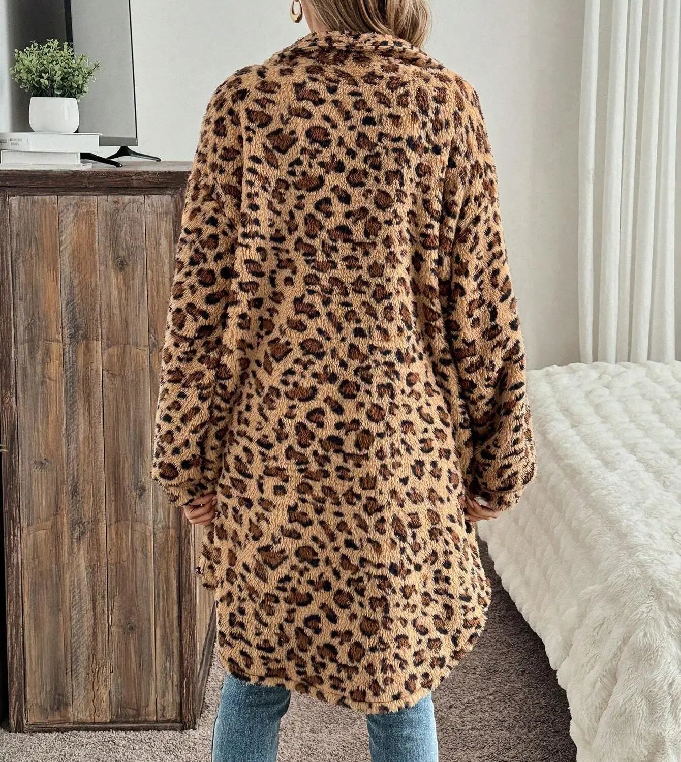 Evlira Leopard Print Plush Coat relaxing pose - comfortable bedroom lounging with loose fit winter jacket