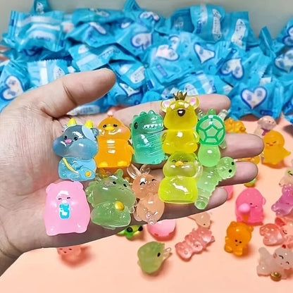 Evlira Luminous Animal Toys held in hand - showing size and colorful glow in the dark animal figurines collection