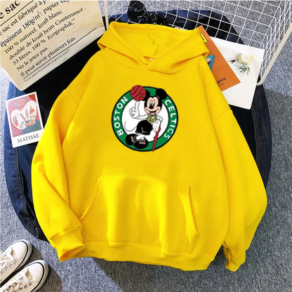 Yellow hoodie with a Boston Celtics logo on a gray surface