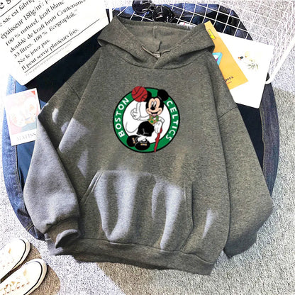 Gray hoodie with Boston Celtics logo on a surface with books and papers.