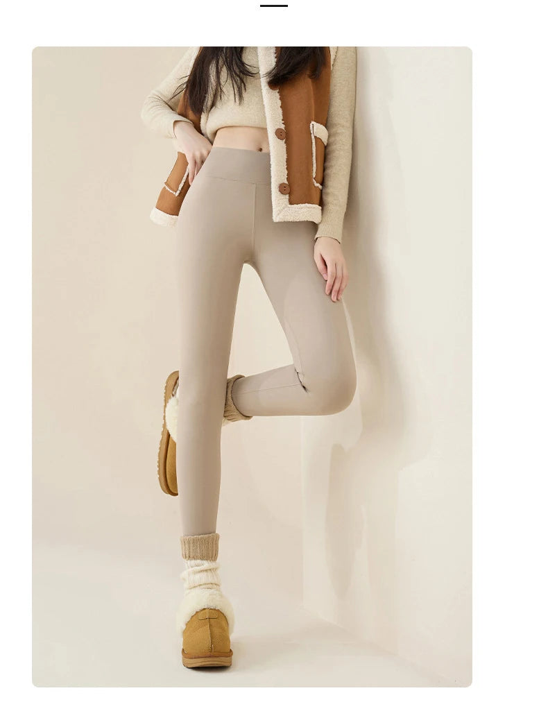 Person wearing beige leggings, brown shoes, and a light-colored jacket on a plain background