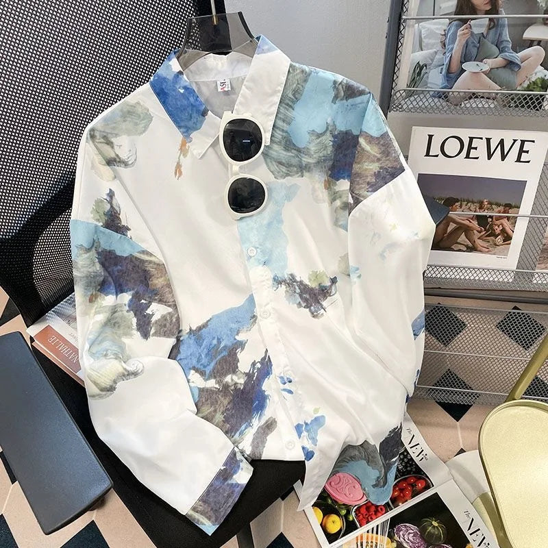 Colorful shirt on a mannequin with sunglasses, placed on a magazine with 'LOEWE' branding.