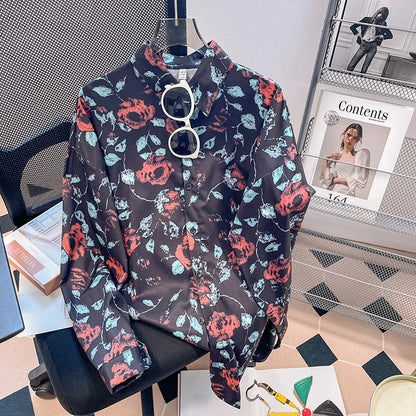 Floral patterned shirt on a hanger with a magazine in the background