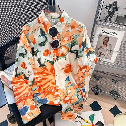 Colorful floral-patterned jacket on a chair with a magazine in the background
